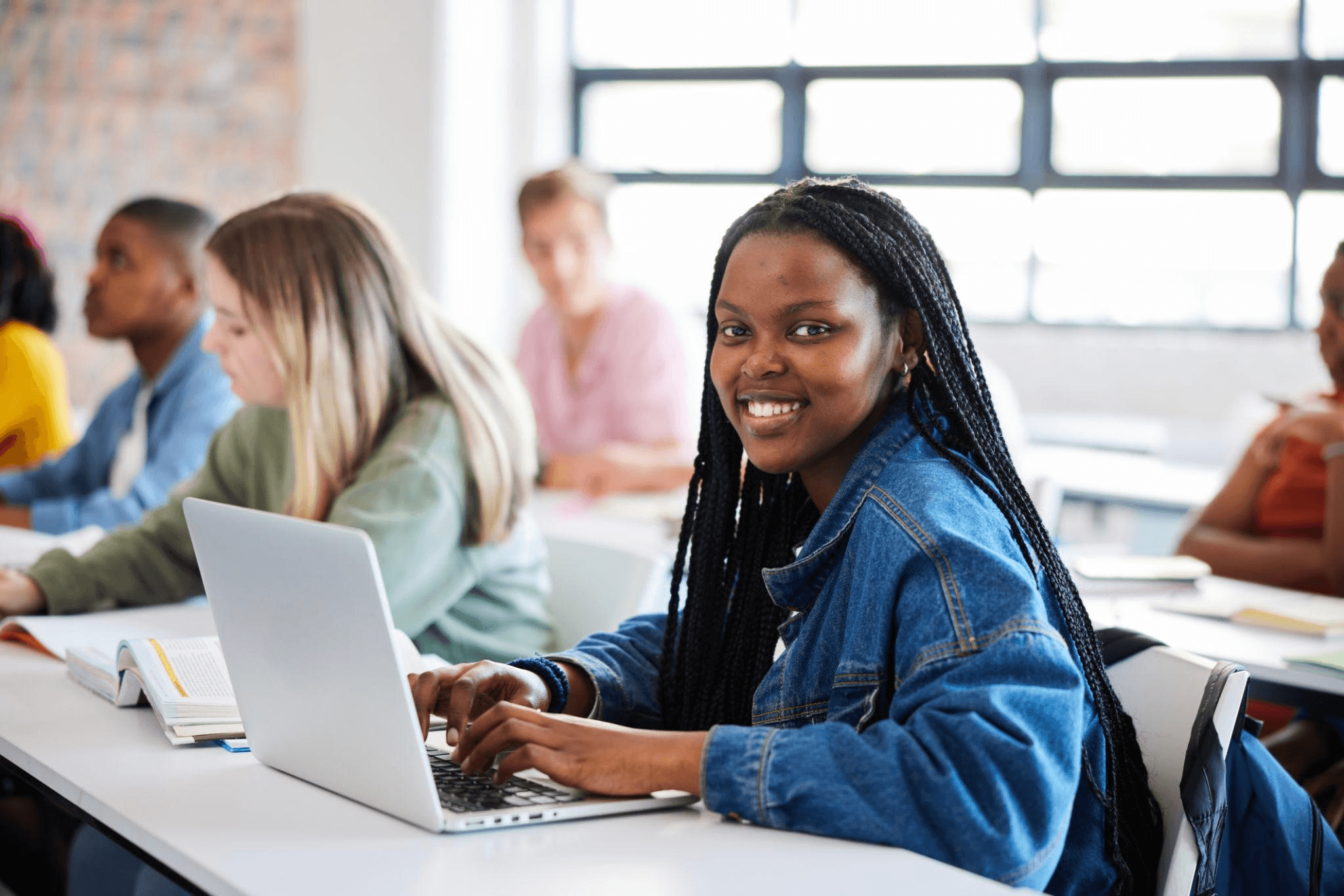 Entry-level technology student learning with a laptop